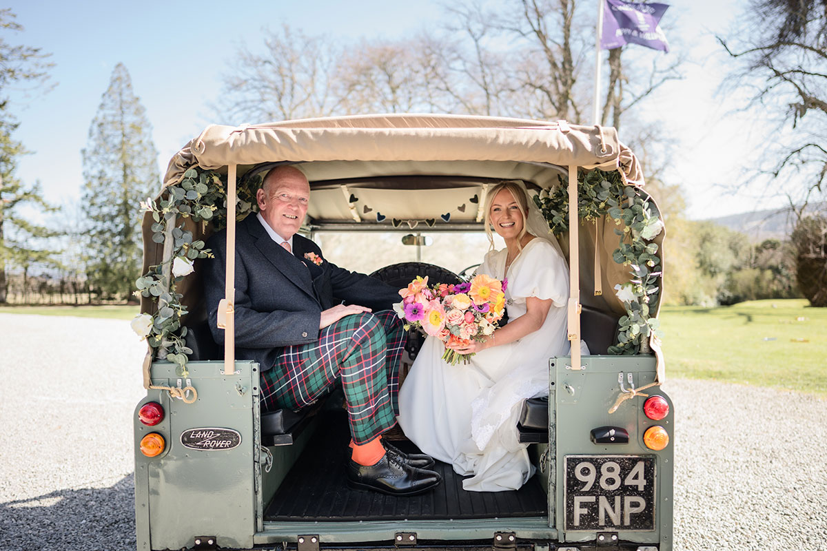 land rover jeep escorts bride and father of the bride at achnagairn castle wedding