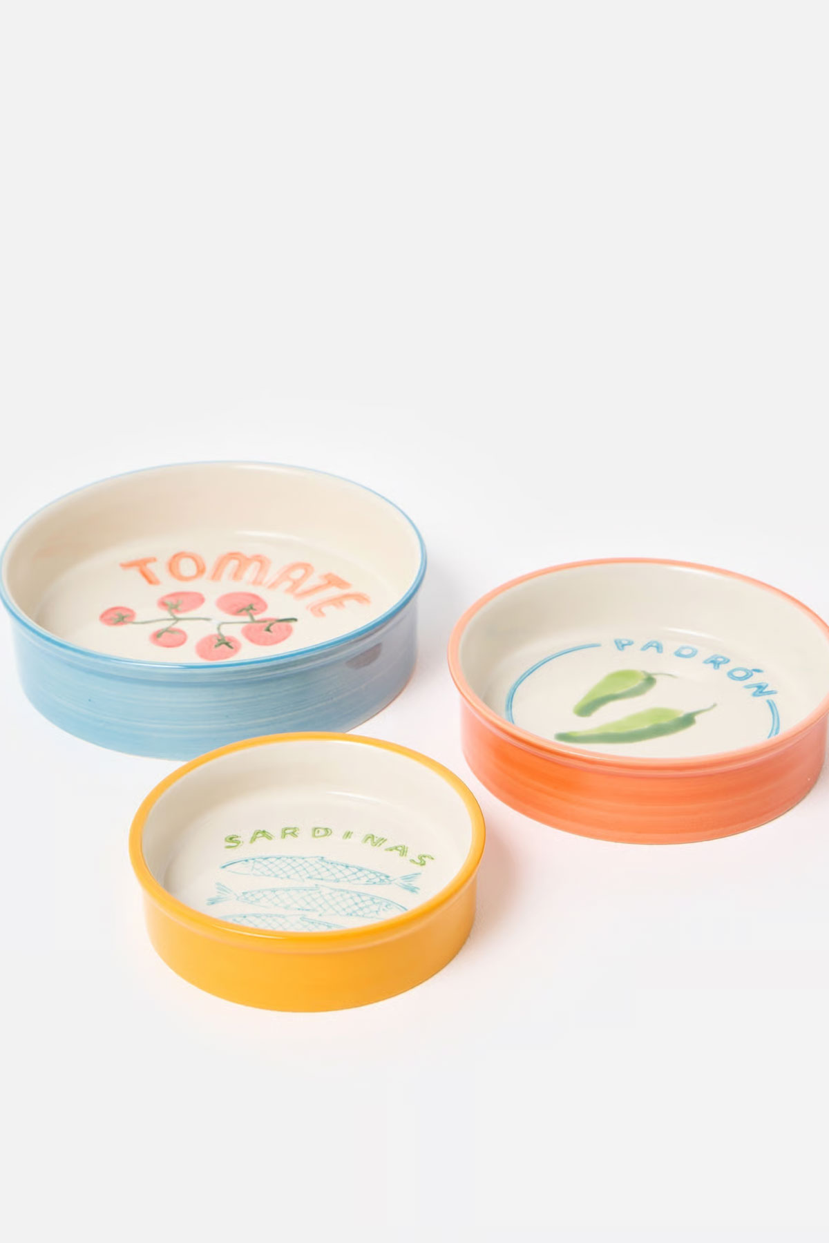 Oliver Bonas ceramic tapas bowls set with tomato, padrón pepper and sardine illustrations, a colourful wedding gift for food-loving couples