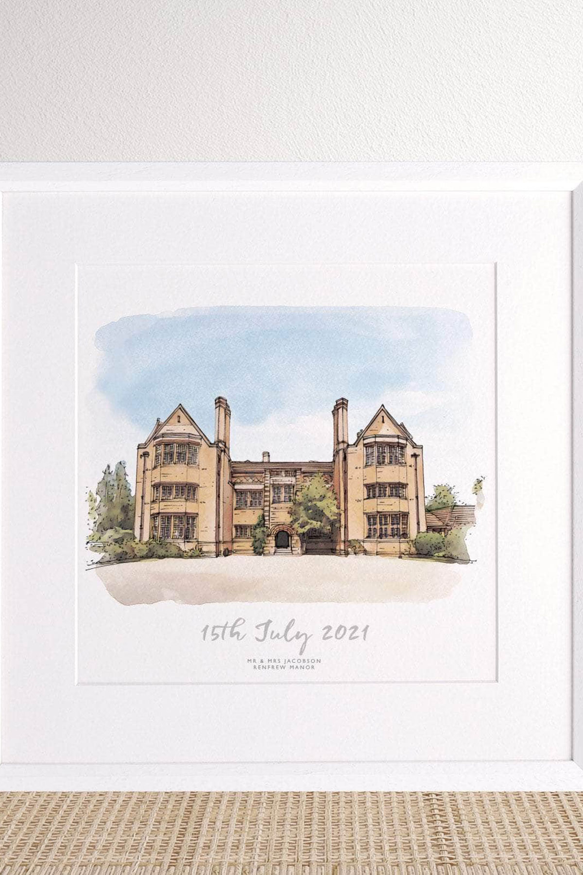 Framed watercolour wedding venue sketch with couple names and date, a thoughtful personalised gift for newlyweds