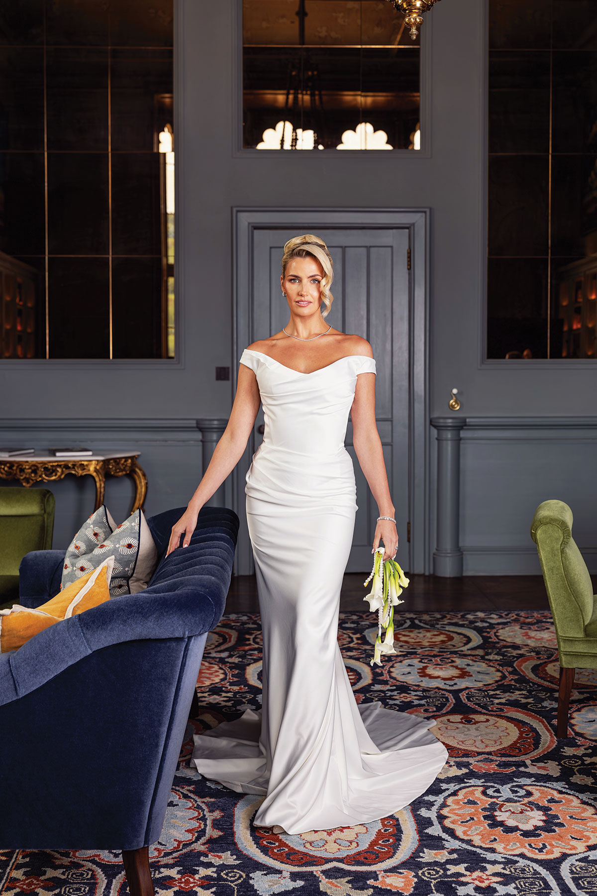 Bride wearing contemporary off-the-shoulder wedding dress and diamond jewellery during Mar Hall bridal editorial