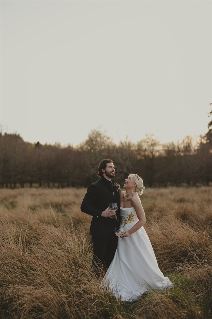 A bride and groom in a field