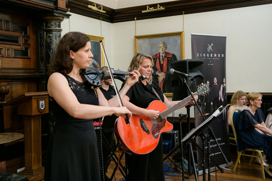 Musicians from Jiggered band playing instruments