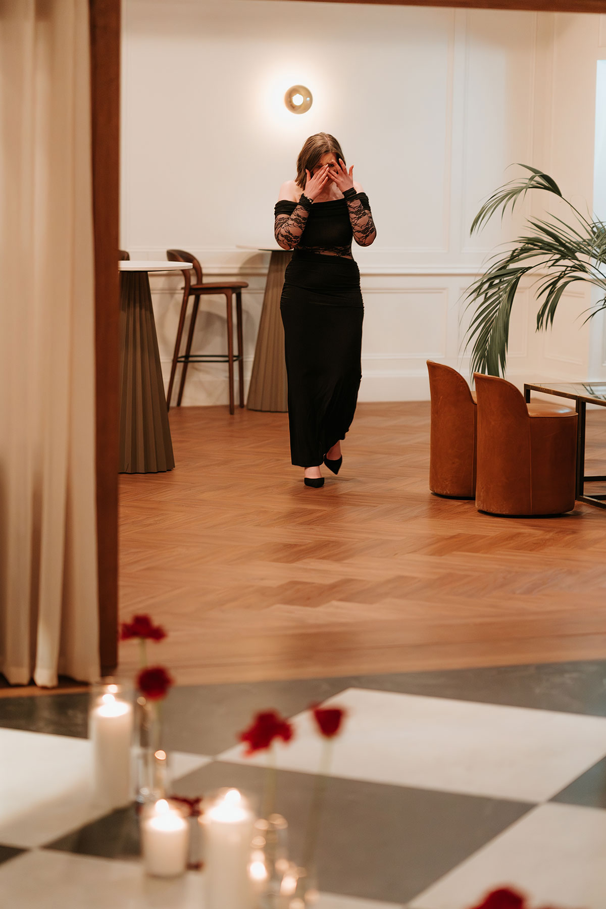Surprise engagement proposal setup with candles and red roses in an elegant Glasgow venue