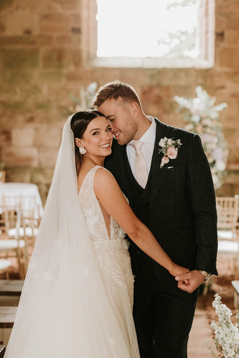 a bride and groom posing for a photo in Dunglass Collegiate Church