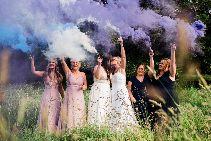 Bridal party with smoke bombs