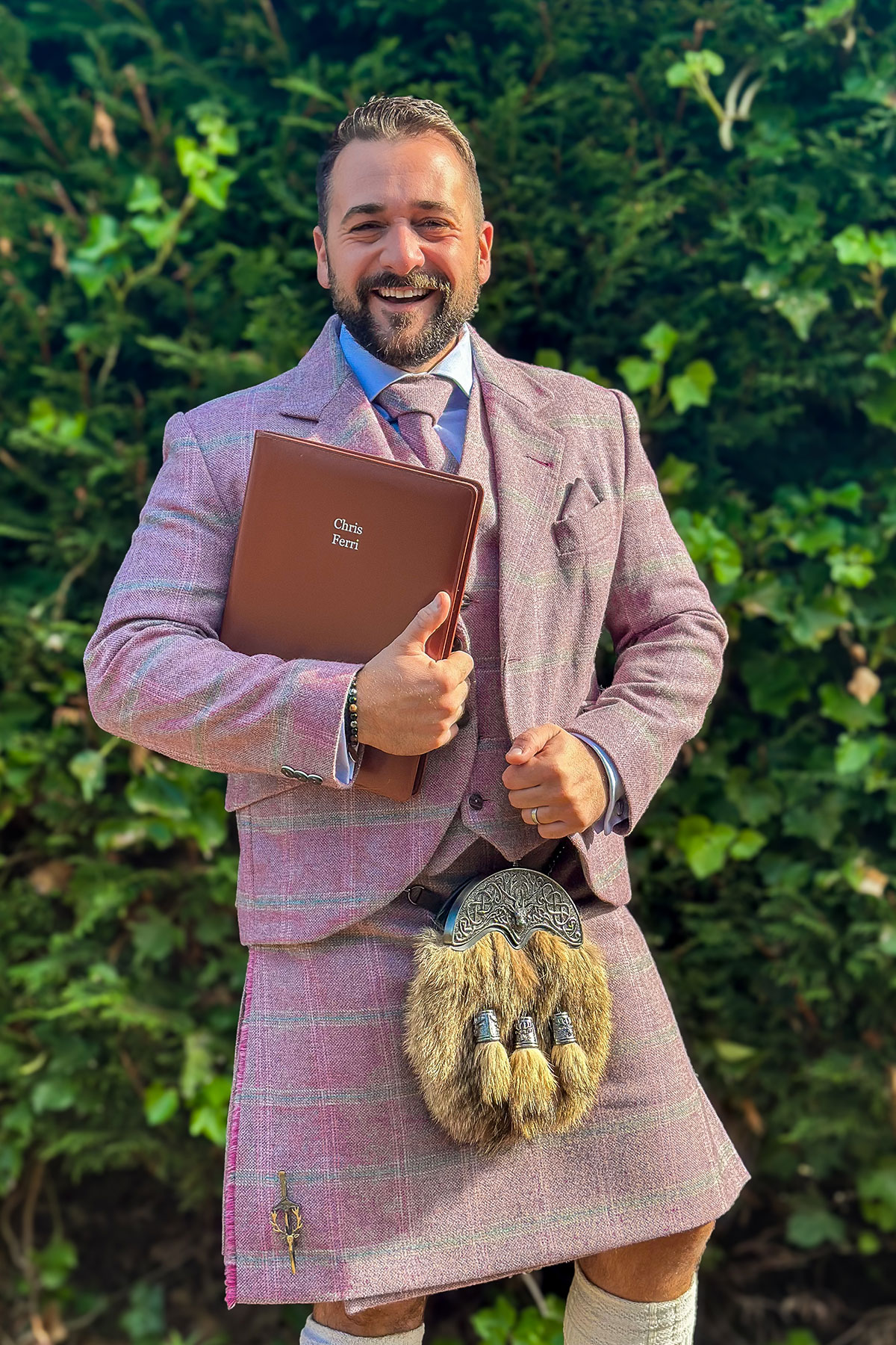 Chris Ferri in pink tartan kilt, The Scottish Celebrants.