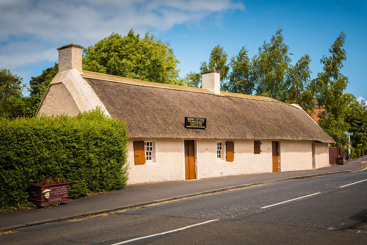 Exterior of Burns Cottage in Alloway, a traditional thatched building marking the birthplace of Robert Burns.