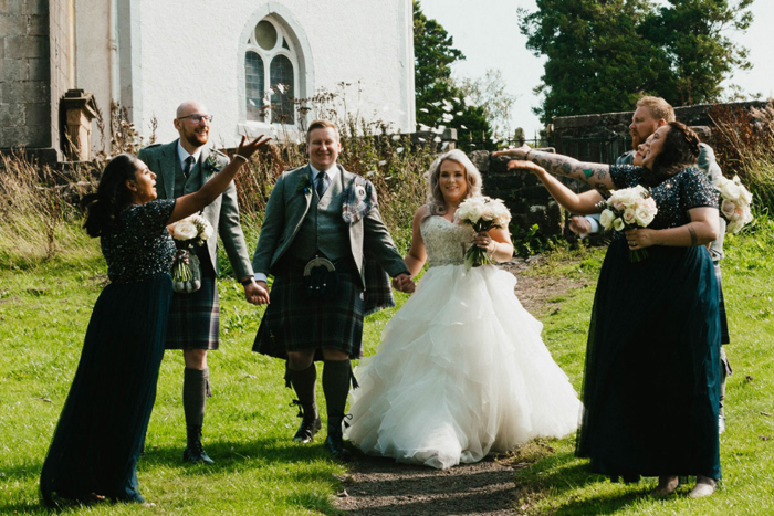 A Bride And Groom With Guests Throwing Confetti At Eaglesham Parish Church