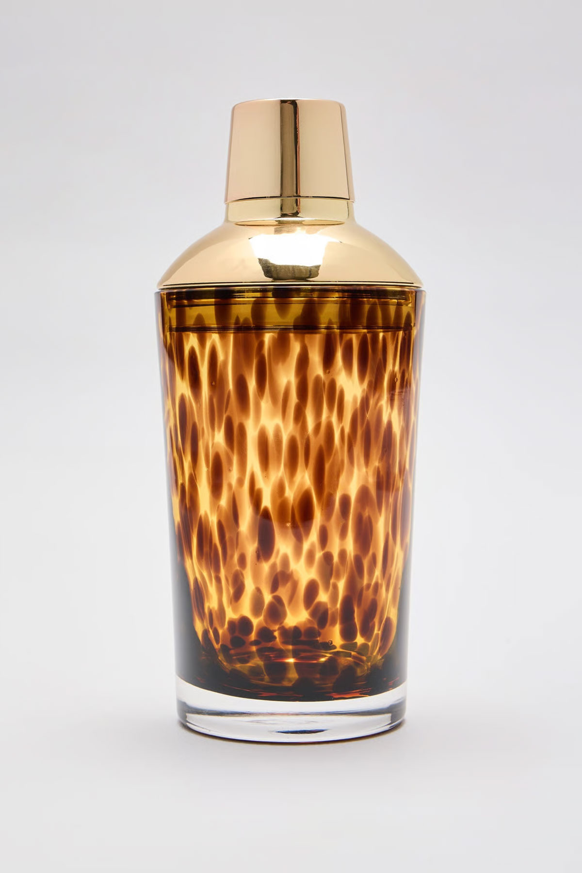 Oliver Bonas glass cocktail shaker with amber lid, a modern wedding gift idea for couples who love making cocktails