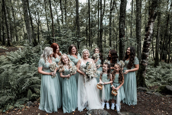 Bride and bridal party wearing blue dresses