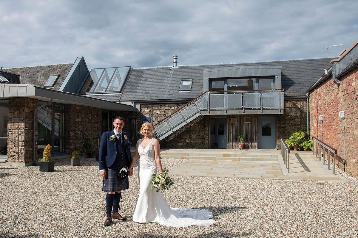 Ardoch Loch Lomond wedding venue bride and groom in exterior courtyard