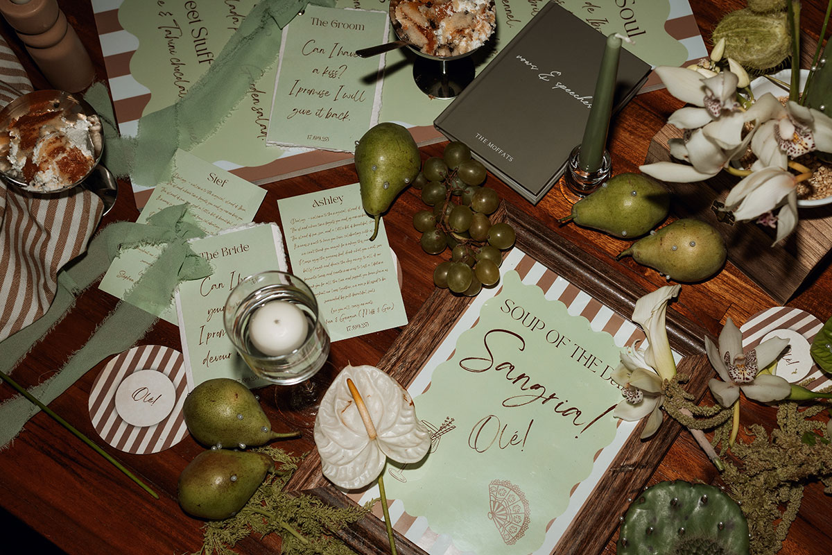 Green and brown striped wedding stationery, menus and tablescape details at Can Rafal Ibiza destination wedding