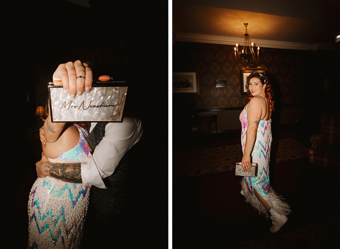 A woman in a long white sequin dress holds a 'Mrs Neasham' engraved clutch bag to the camera