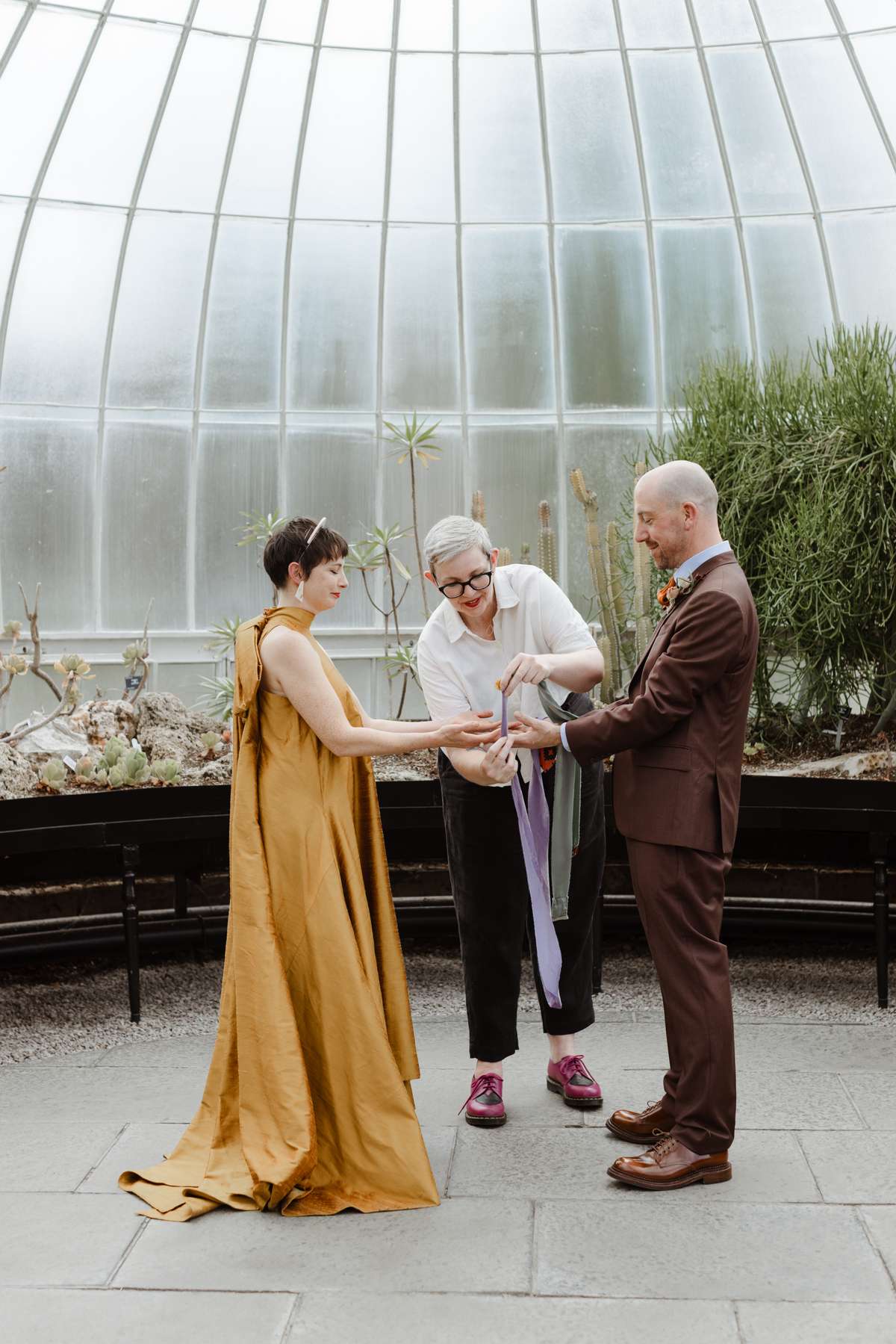 Handfasting ceremony at a Kibble Palace wedding in Glasgow