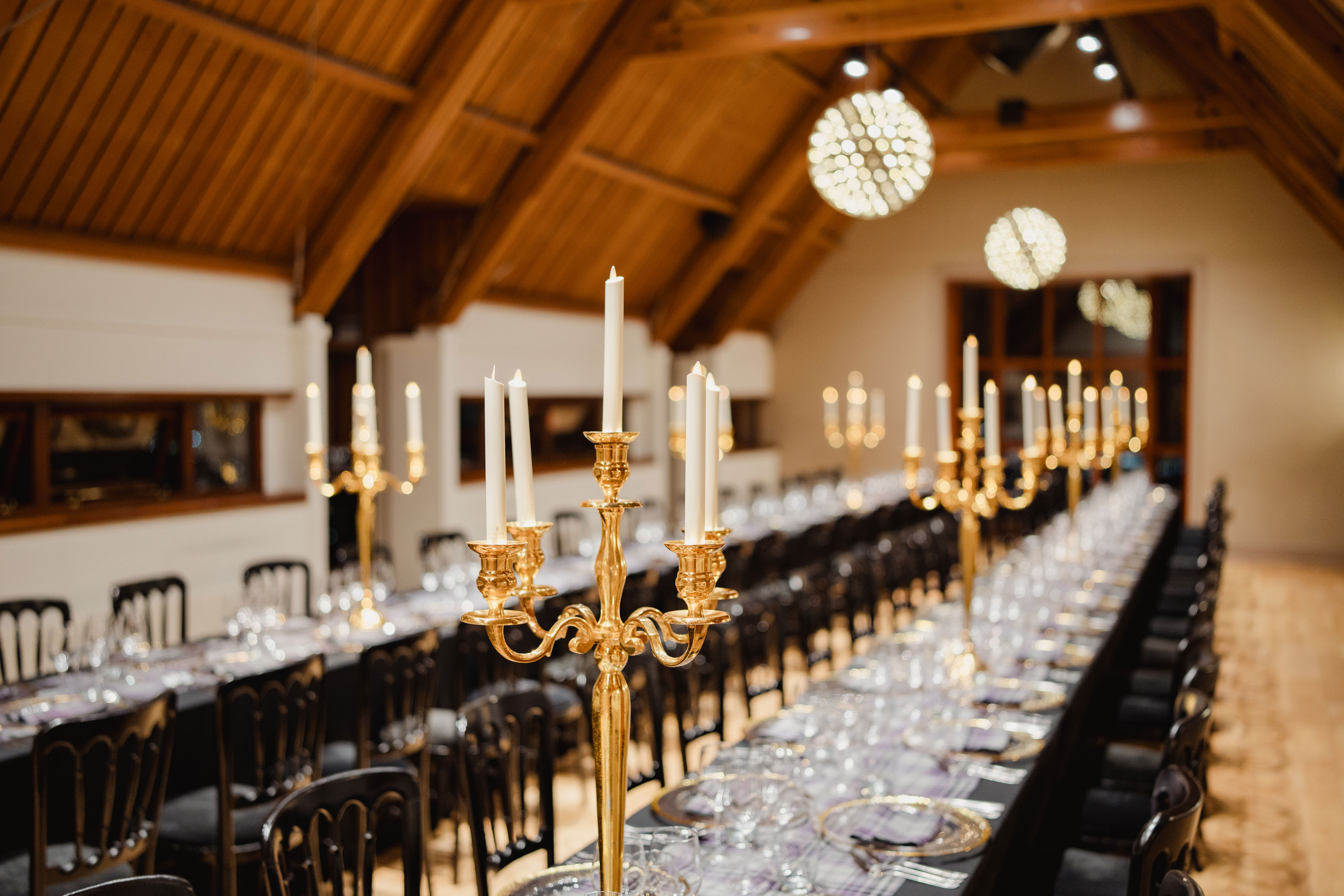 candleabra in focus dinner set up wedding edinburgh castle