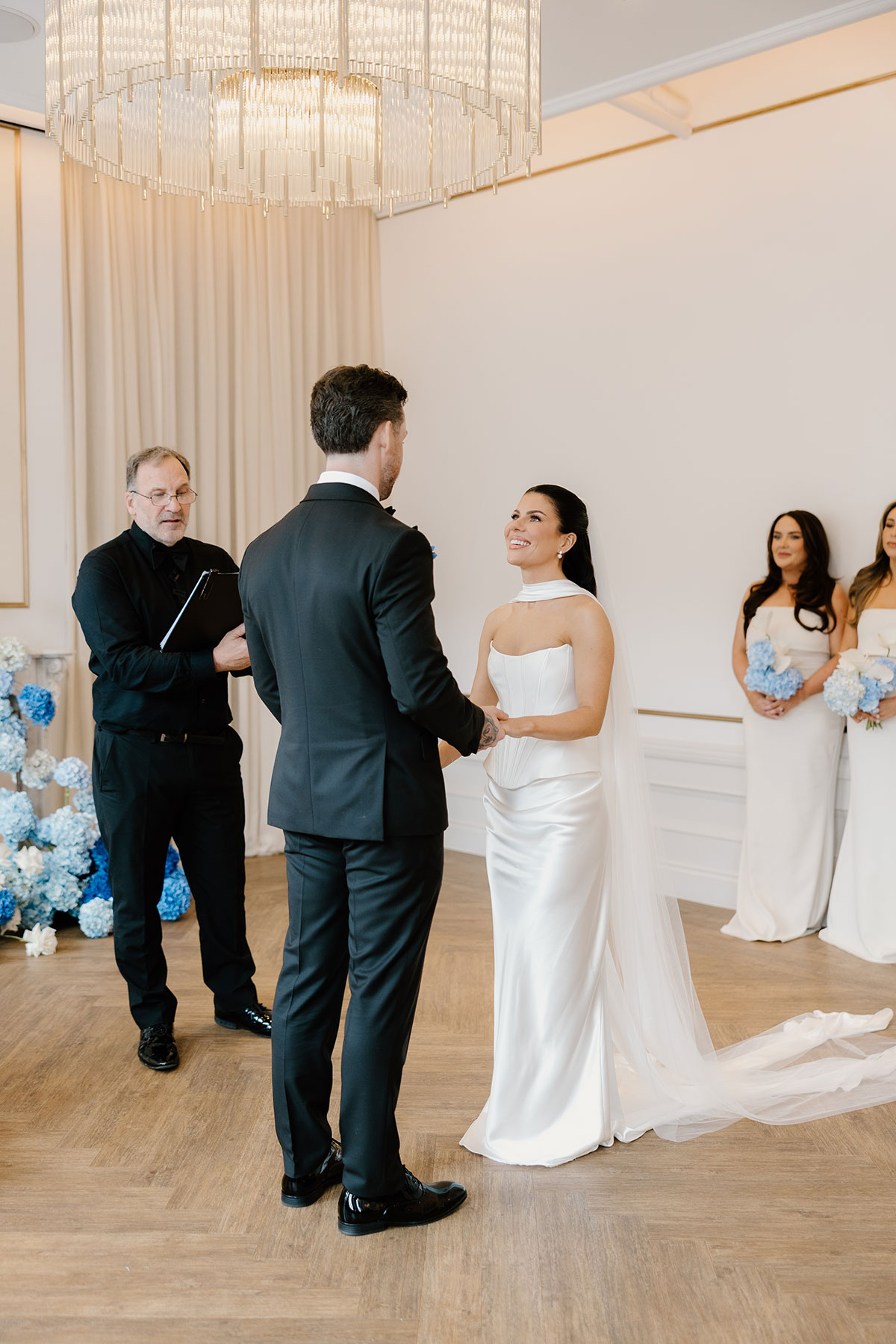 Bride and groom exchanging vows during modern Glasgow city centre wedding ceremony at The Exchange