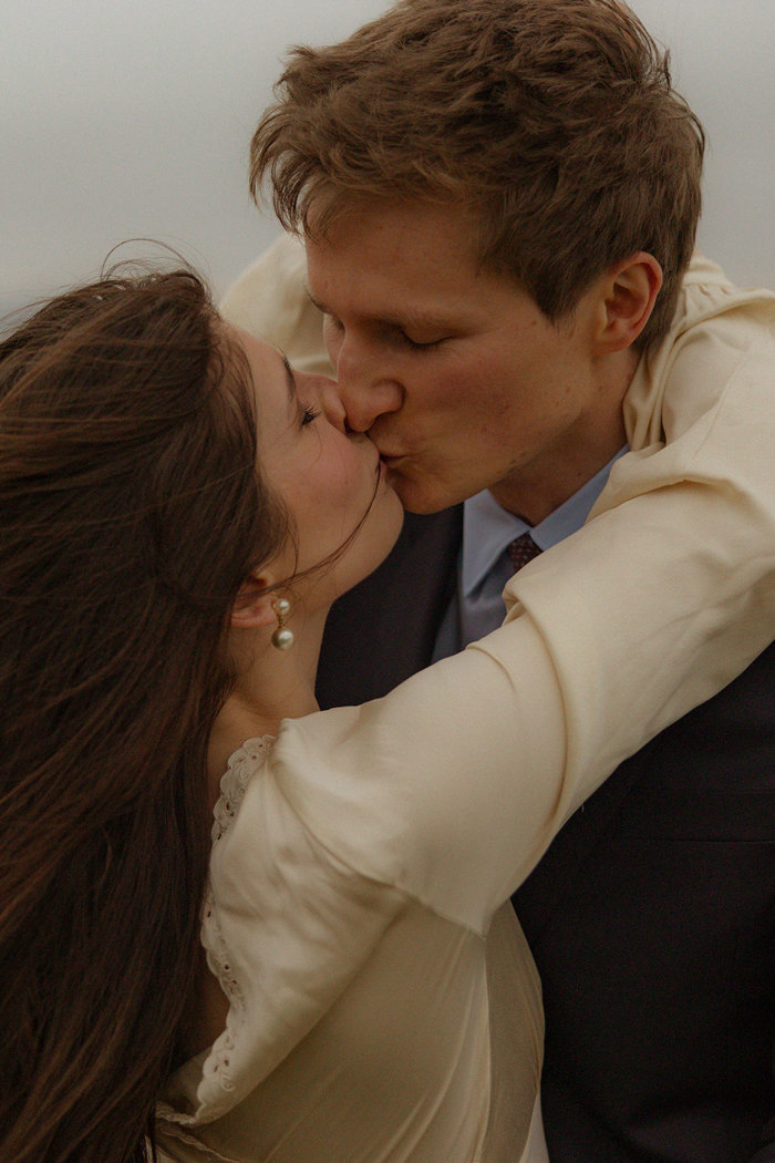 bride and groom kiss at guardswell farm
