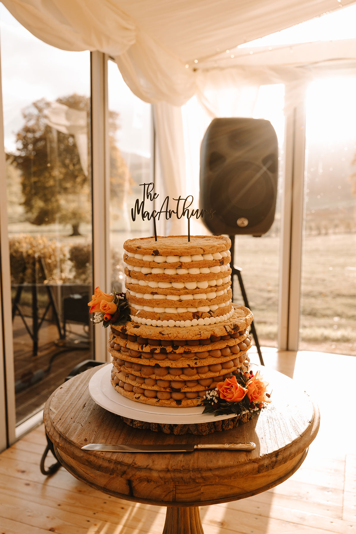 Tiered cookie cake with sign reading 'the macarthurs'