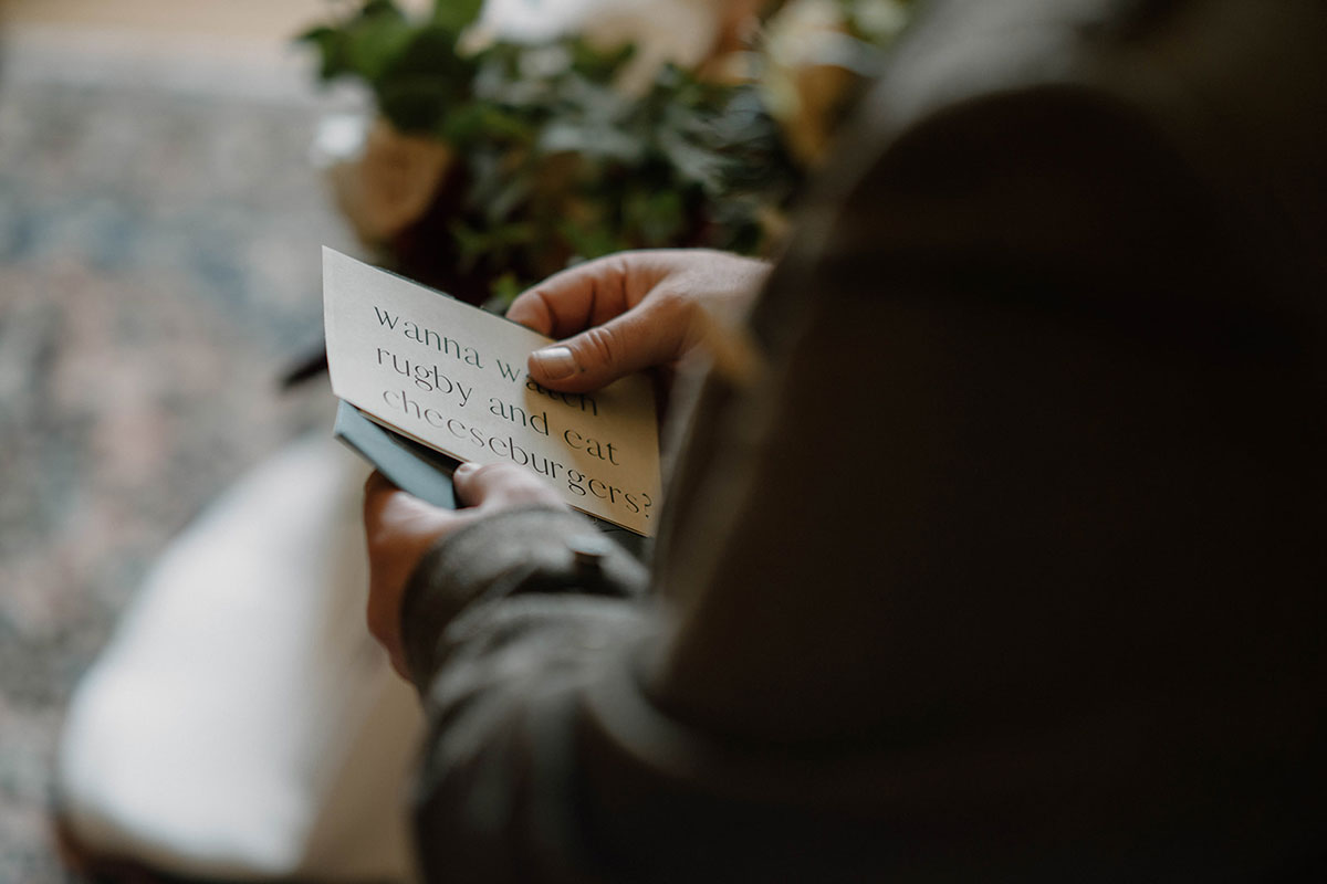 Close-up of a handwritten letter to the groom, read on the morning of a Scottish castle wedding.