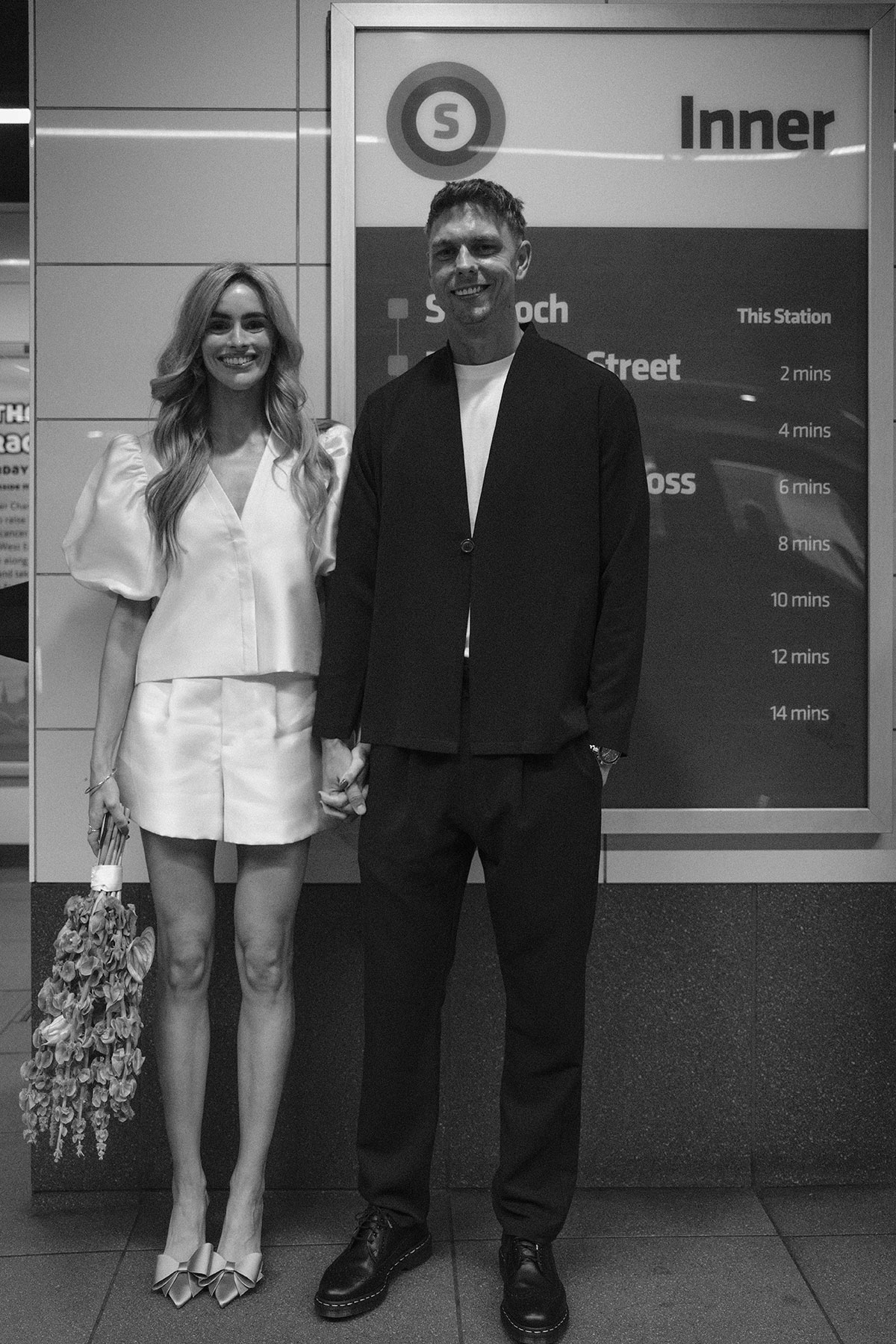 Bride and groom on Glasgow subway platform after intimate city wedding ceremony at St Andrew’s Cathedral