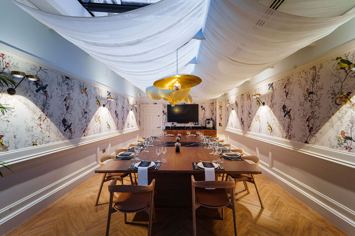treasury room at the collector's hall set up for private dinner with white drapes and wooden table
