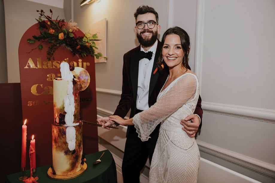 Bride And Groom Cutting Wedding Cake By Celebration Cakes By Rebecca Grace Banks
