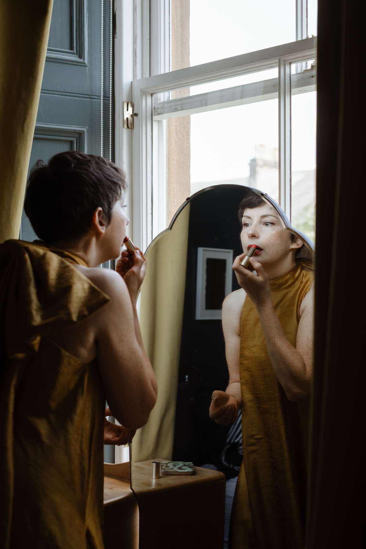 Bride getting ready on the morning of a colourful Glasgow wedding