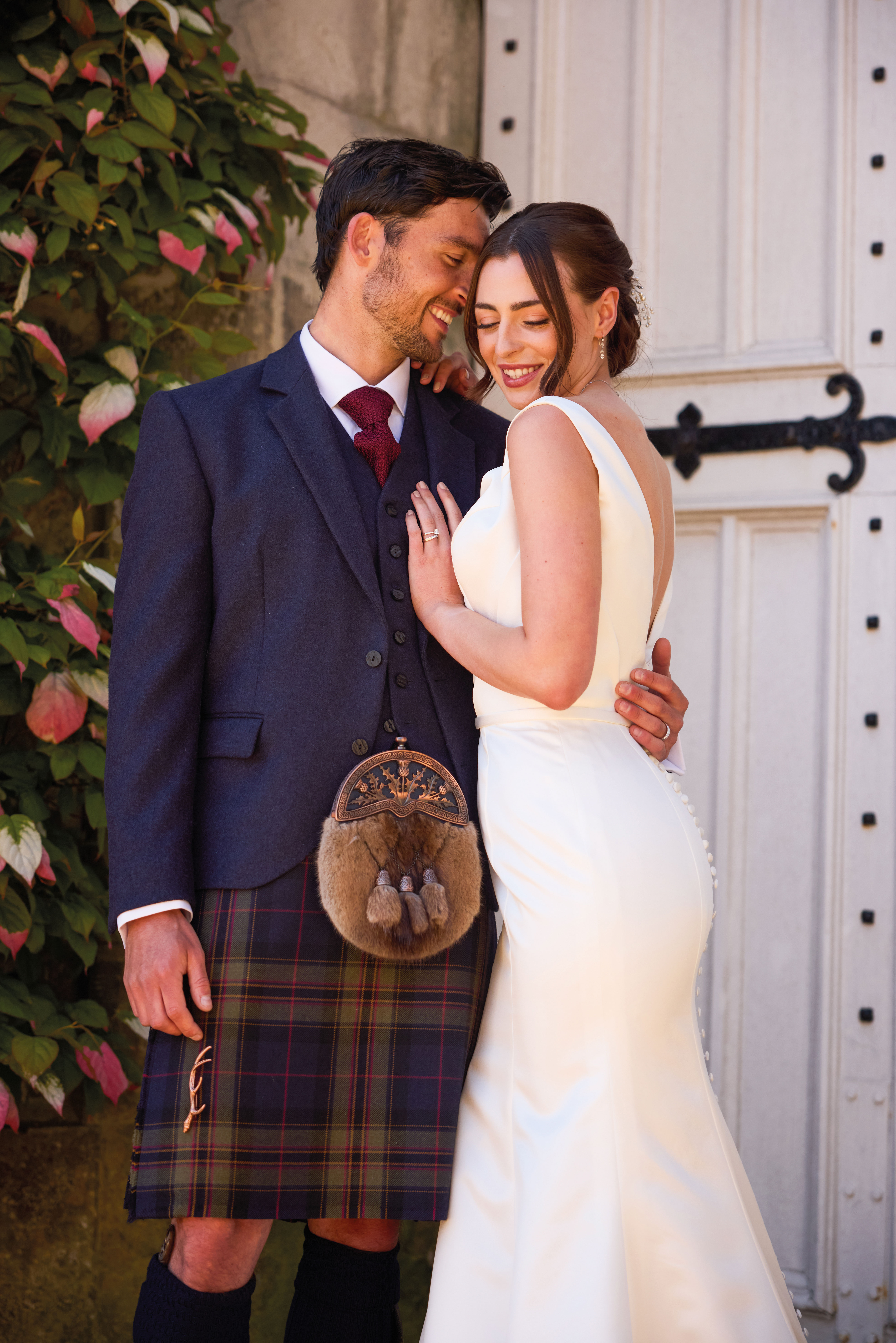close up of bride and groom at dundas castle for McCalls Highlandwear Pride of Noble tartan photoshoot