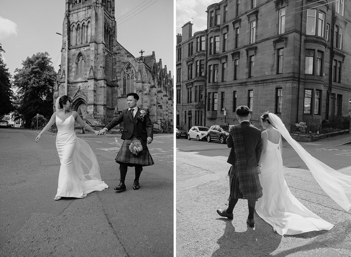 a bride and groom walking outside a tall church building on left. A bride and groom walking along a street with Glasgow tenement building in background