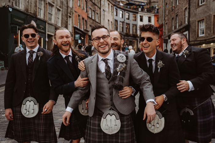 Groom and groomsmen in their kilts in Edinburgh's Old Town