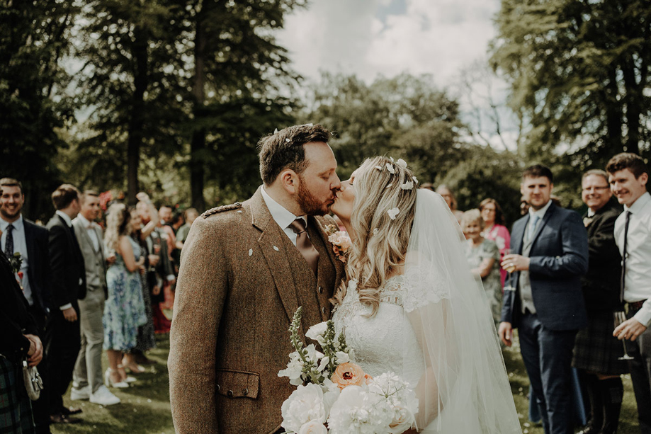 Bride and groom kiss after the ceremony