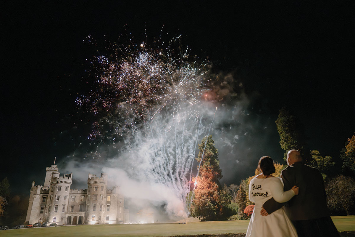 Fireworks display illuminating Cluny Castle grounds during an autumn wedding reception in Aberdeenshire.