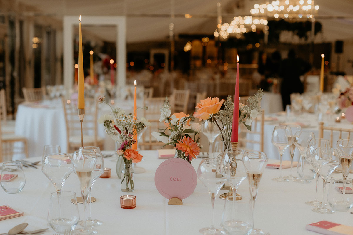 candles and flowers on a table at a Carlowrie Castle wedding reception