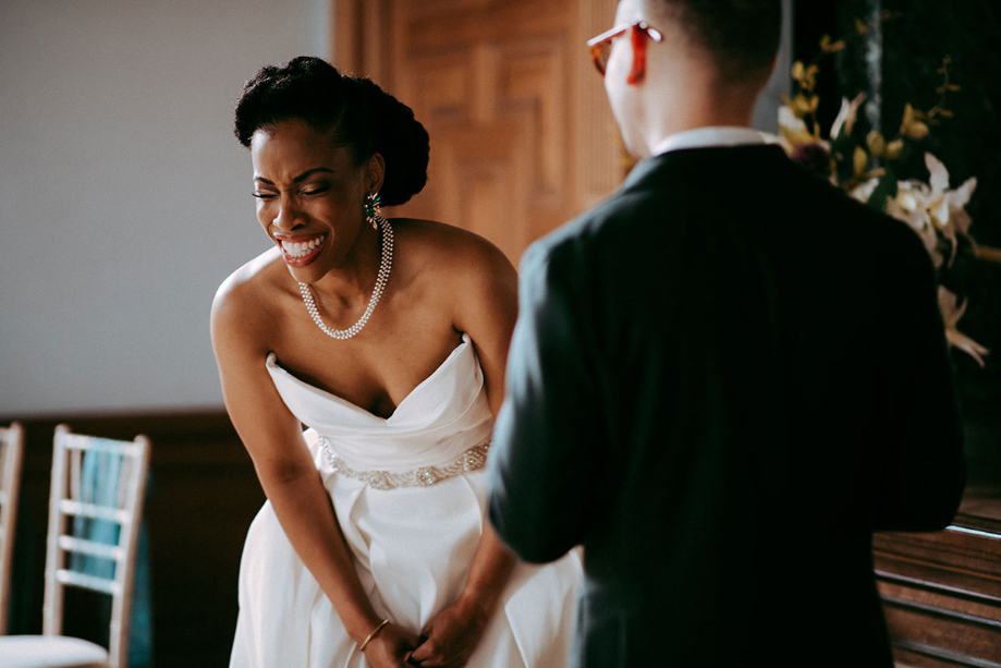Bride laughs during ceremony
