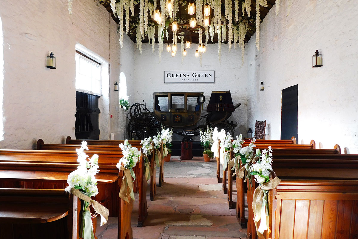 Ceremony setup inside the Coach House Marriage Room at Gretna Hall, a historic wedding venue in Gretna Green.
