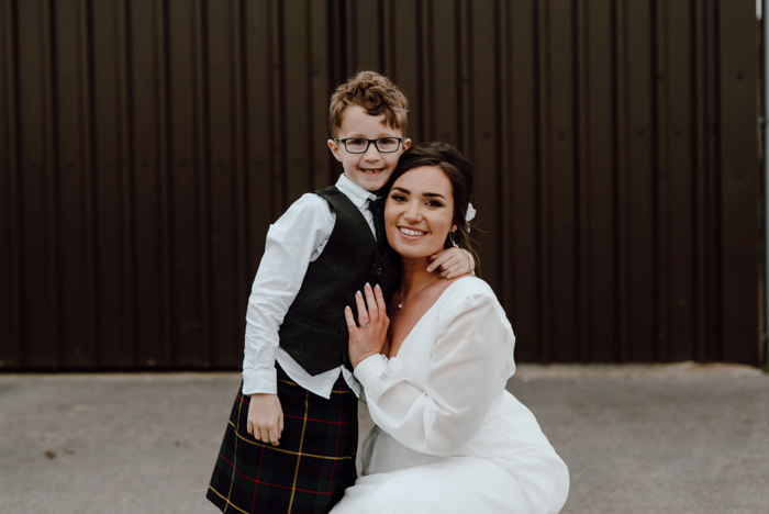 Bride and her son embrace