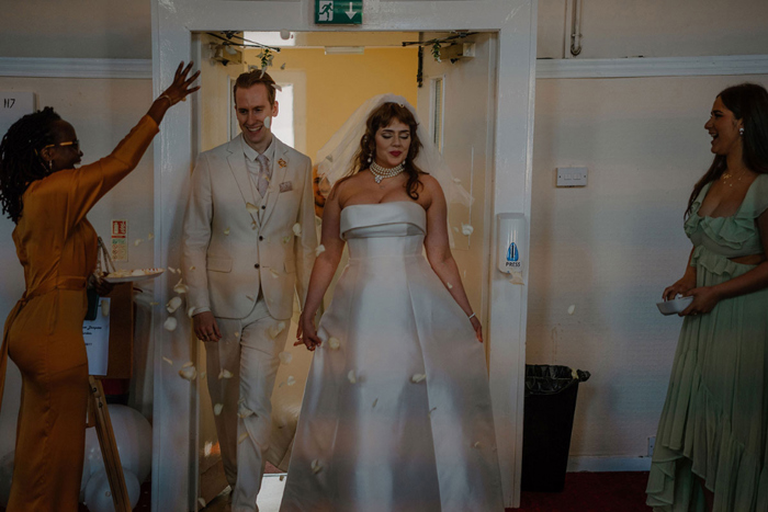 Bride and groom arriving at their wedding reception at Garnethill Multicultural Centre
