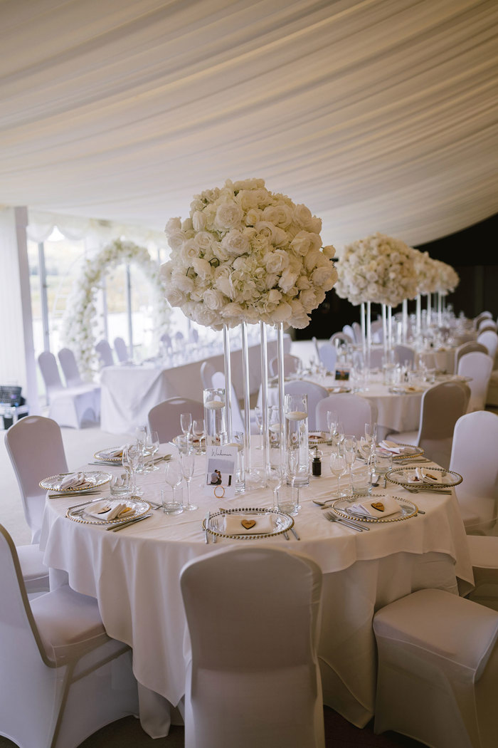 A table set for a wedding reception in the permanent marquee at Mar Hall.