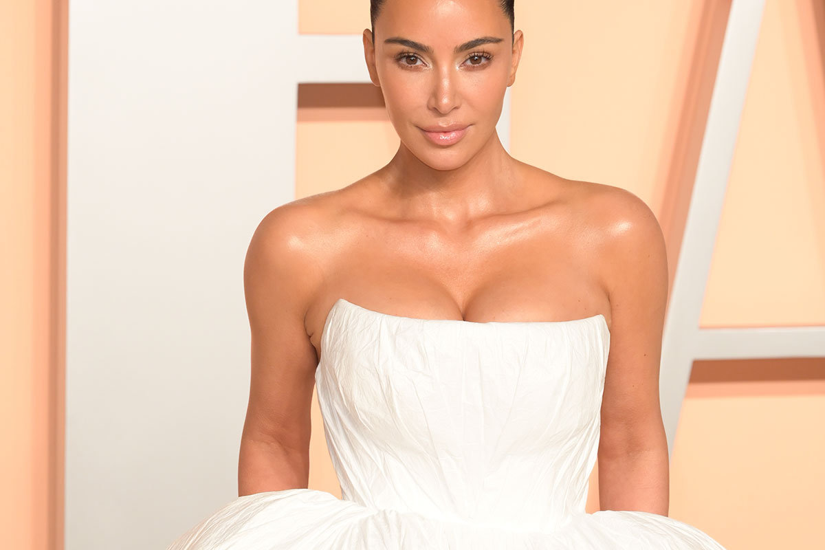 Kim Kardashian wearing a white dress at an event
