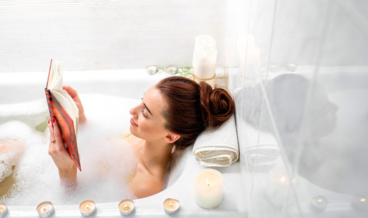 Woman soaks in bubble bath