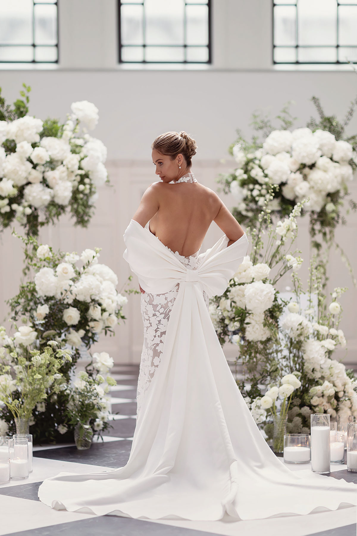 Backless lace halterneck gown with oversized bow train at The Collector’s Hall Glasgow