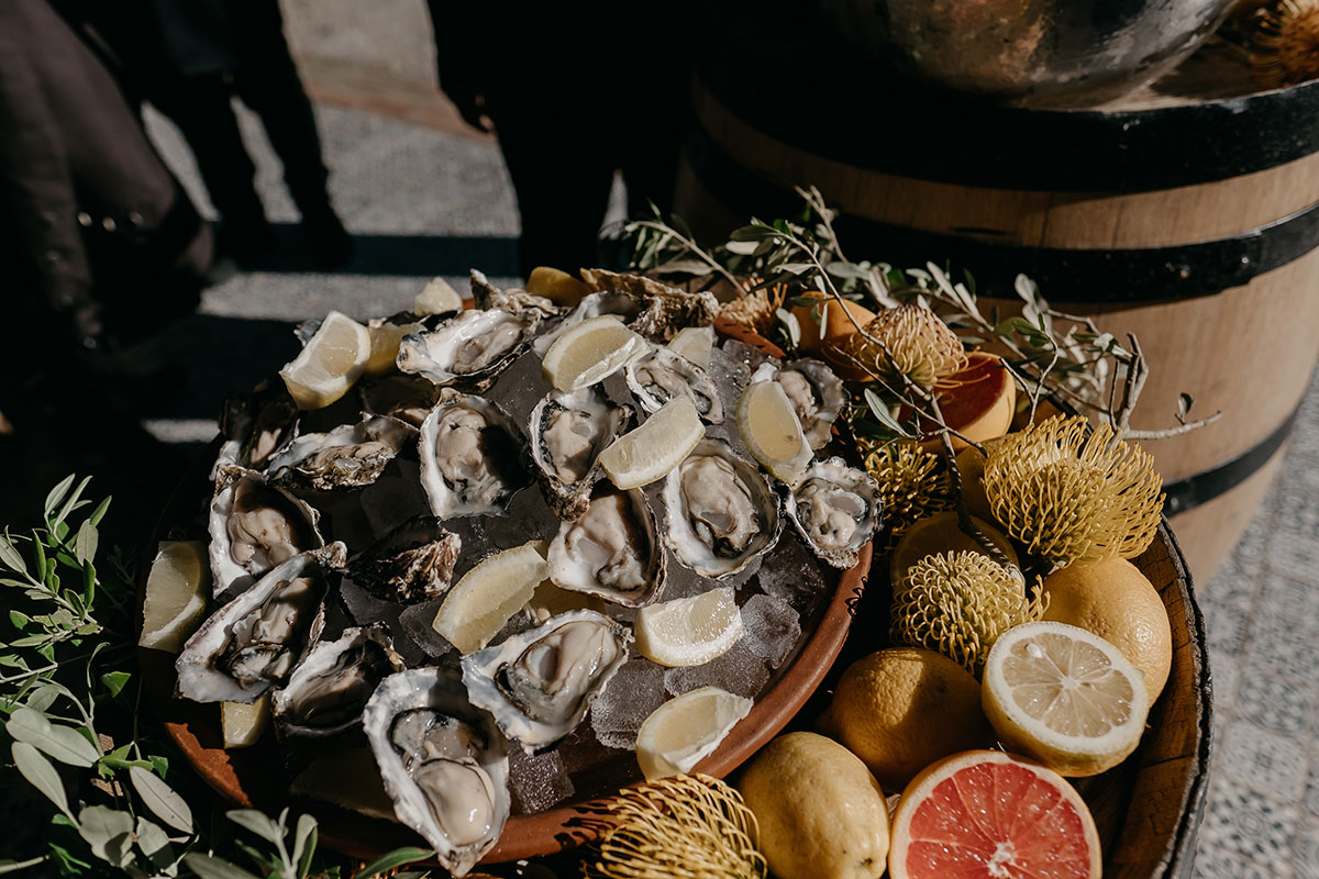 Fresh oyster platter served during drinks reception at Boschendal Wine Estate destination wedding in South Africa