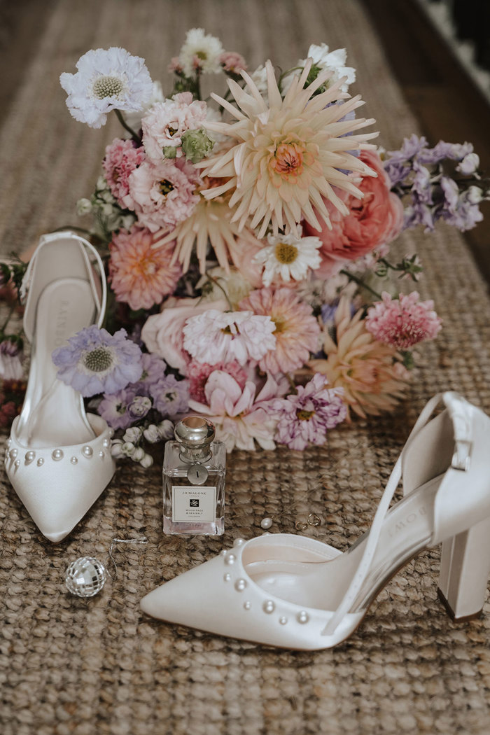 bride's bouquet with shoes, perfume and jewellery