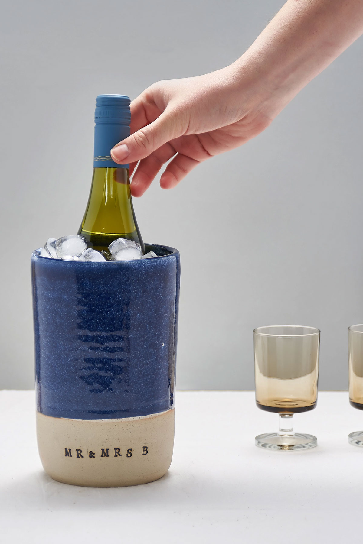 Personalised ceramic wine cooler with bottle and ice, a thoughtful wedding gift for couples who love hosting at home