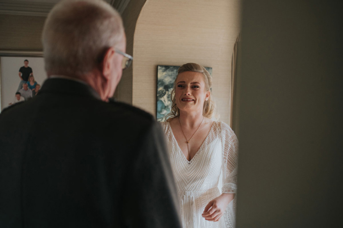 Emotional bride reacts to her father seeing her dress for the first time