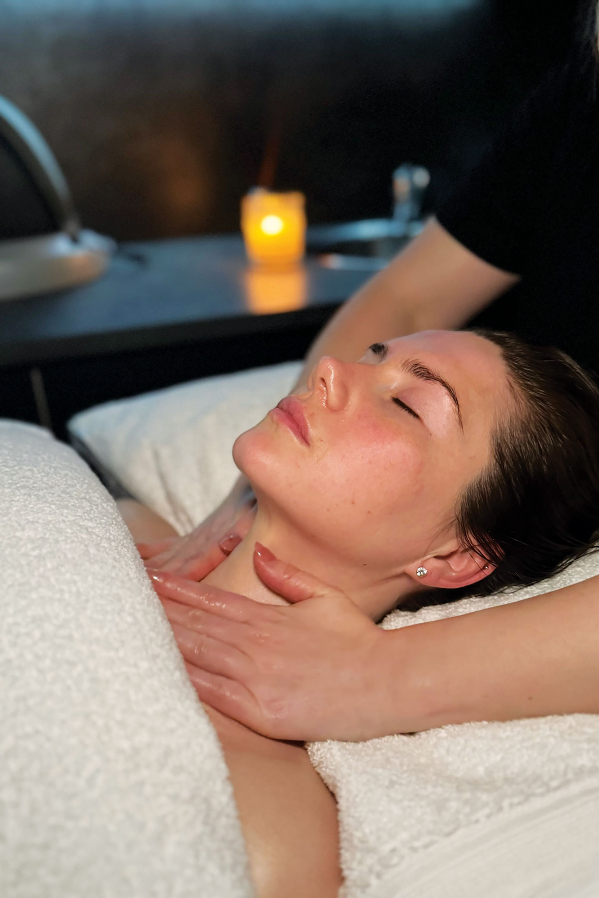 Client receiving a relaxing facial massage at FAB Salons in Glasgow during a pre-wedding skincare treatment.