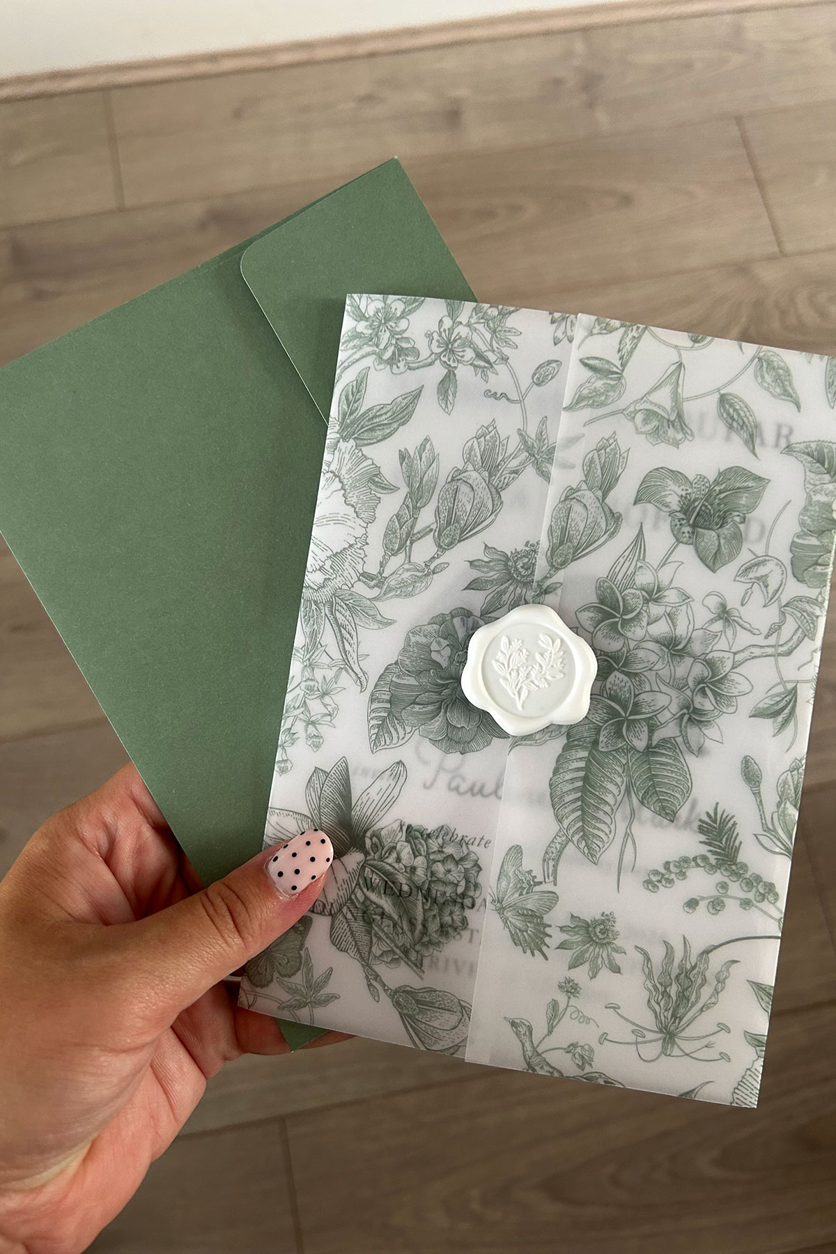 a green and white leaf pattern wedding invite