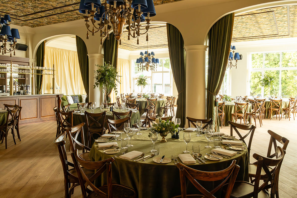 Wedding reception room at Dornoch Station with round tables and classic hotel interiors