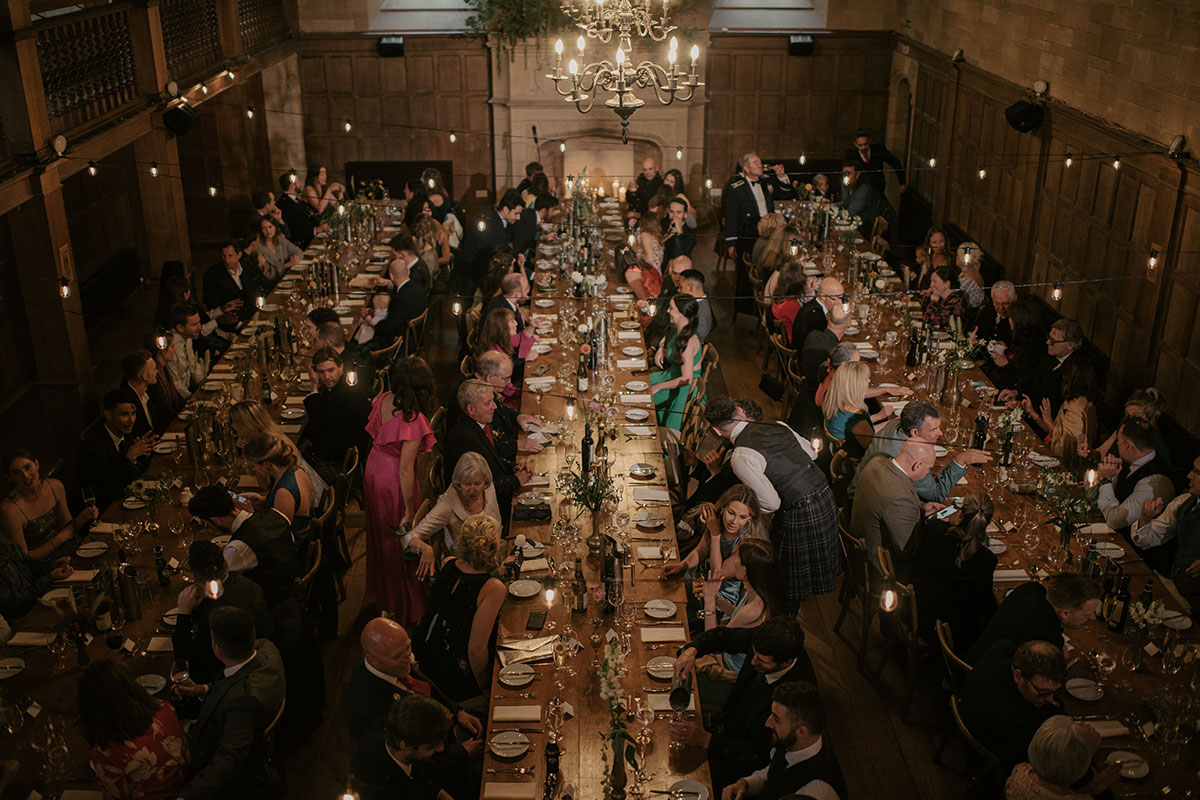 Achnagairn Castle wedding dinner in ballroom with long wooden tables