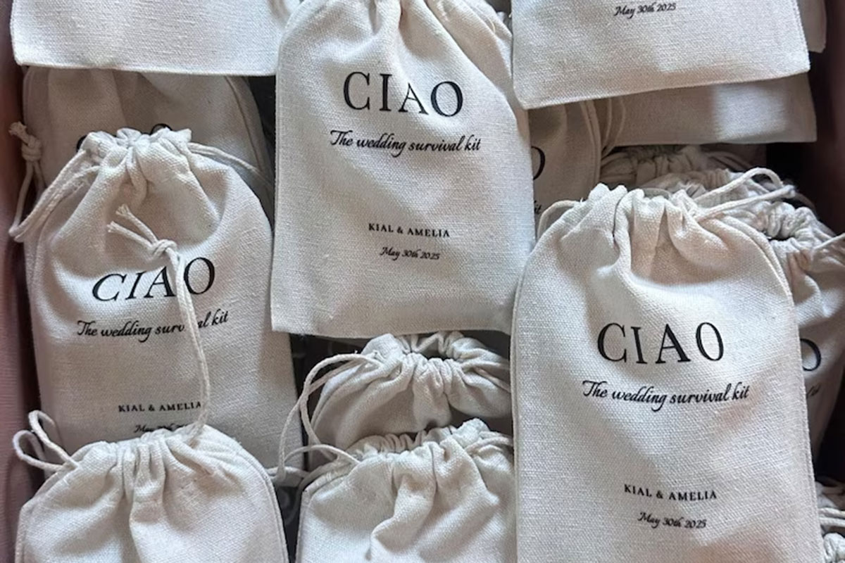 Personalised canvas wedding survival kit favour bags with couple’s names and wedding date